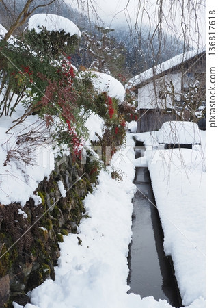 Snowy scenery of Miyama and red berries of nandina Snowy scenery of Miyama and red berries of nandina 136817618