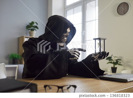 Grim Reaper Holding Hourglass In Office 136818323