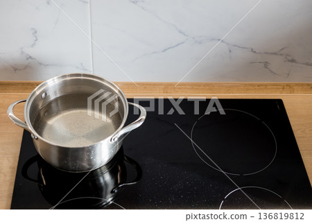 water begins to stainless boil in pot 136819812