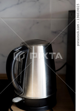 electric kettle on kitchen table 136819815