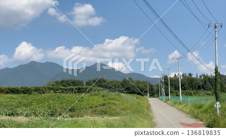 Hokuto City, Yamanashi Prefecture: Rural landscape and farm road with mountain ranges Hokuto City, Yamanashi Prefecture: Rural landscape and farm road with mountain ranges 136819835