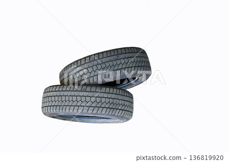 Two car wheels on white. Seasonal change of car Two car wheels on white. Seasonal change of car 136819920