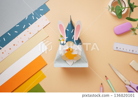 Paper craft. Gnome with rabbit ears and duck in his hands. DIY handmade project for children. Paper craft. Gnome with rabbit ears and duck in his hands. DIY handmade project for children. 136820101