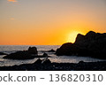 Sunset at Cape Muroto, the sun setting behind the rocks 136820310
