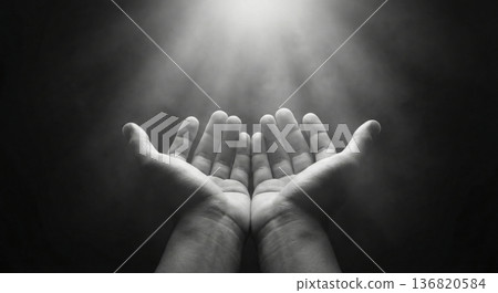 Open hands receiving divine light from above 136820584