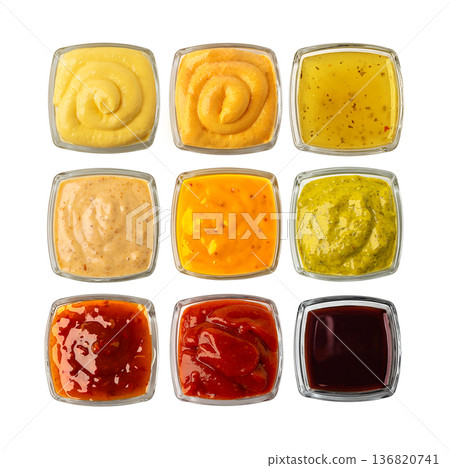 Nine bowls of various sauces and condiments top view 136820741