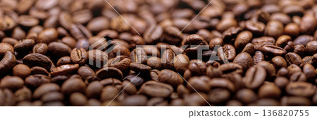 Roasted coffee beans creating background texture and aroma Roasted coffee beans creating background texture and aroma 136820755