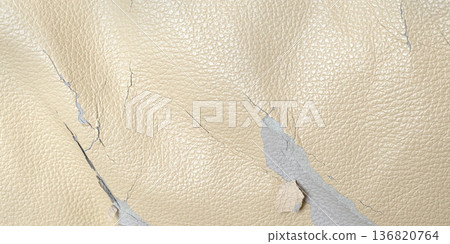 Faux leather peeling showing cracked worn texture 136820764