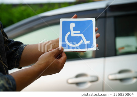 Wheelchair sticker sign on car for safety travel. Wheelchair sticker sign on car for safety travel. 136820804