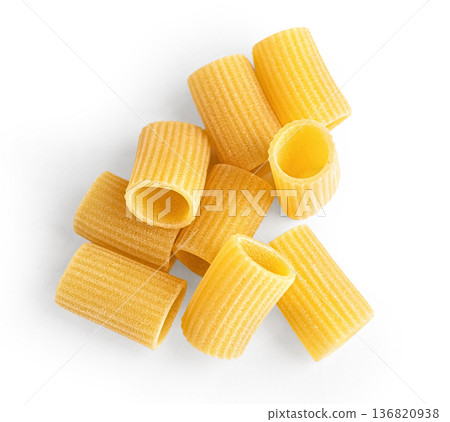 Rigatoni pasta noodles laying on white background Rigatoni pasta noodles laying on white background 136820938