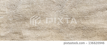 Rough beige textured wall plastering surface background Rough beige textured wall plastering surface background 136820946