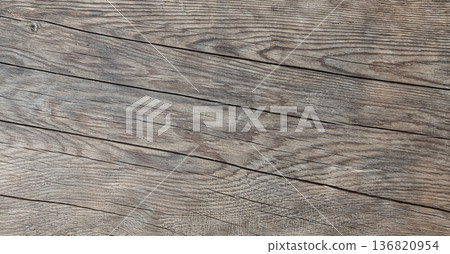 Rustic weathered wood planks displaying natural texture and grain 136820954