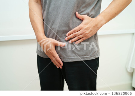 Hernia, Asian man stomach ache, abdominal pain and urology problem health. Hernia, Asian man stomach ache, abdominal pain and urology problem health. 136820966