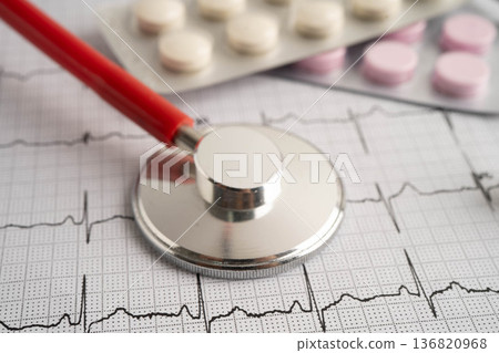 Stethoscope on electrocardiogram ECG, heart wave, heart attack, cardiogram report. Stethoscope on electrocardiogram ECG, heart wave, heart attack, cardiogram report. 136820968