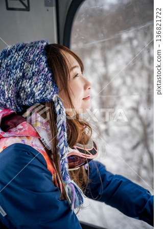 Young woman riding a vehicle to enjoy winter sports Young woman riding a vehicle to enjoy winter sports 136821722
