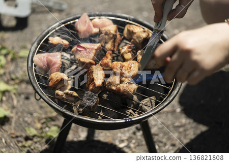 Barbecue grill with meat close up 136821808