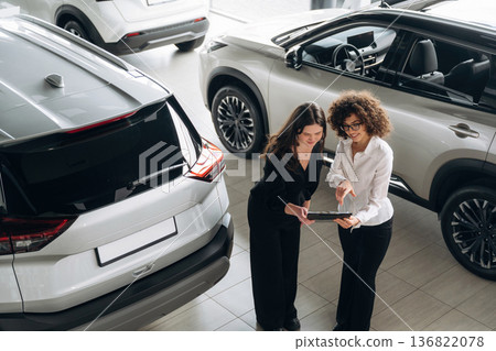 Retail shop worker is helping the customer Retail shop worker is helping the customer 136822078