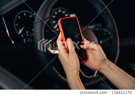 Close up view of woman that is sitting in the car Close up view of woman that is sitting in the car 136822178