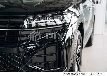 Particle view of modern black car that is parked indoors 136822190