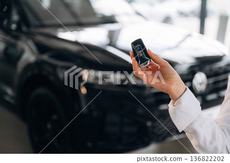 Detailed view of woman that is holding keys for new car 136822202