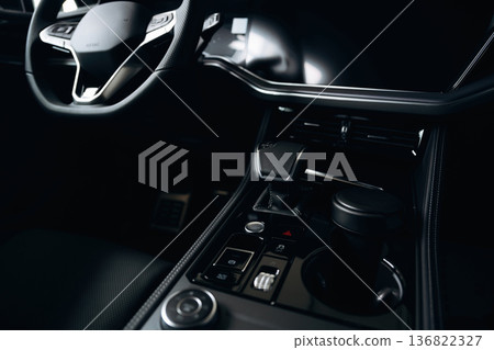 Front panel with steering wheel. Interior of the modern car, close up view Front panel with steering wheel. Interior of the modern car, close up view 136822327