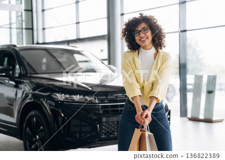 Pretty woman is in the car retail shop Pretty woman is in the car retail shop 136822389