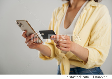 Close up view of woman that is in the studio against background Close up view of woman that is in the studio against background 136822530