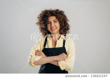 Female waiter is standing in the studio Female waiter is standing in the studio 136822547