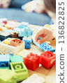 Colorful toy blocks are laid out on the background material. It can be used for presentations, slideshows, and corporate documents. 136822825