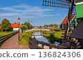 Traditional Dutch Windmills And Wooden Houses In Netherlands Village 136824306