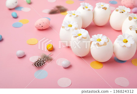 Easter spring  holiday card. Playful bunny, painted eggs, spring flowers, decorative elements on light pink background 136824312