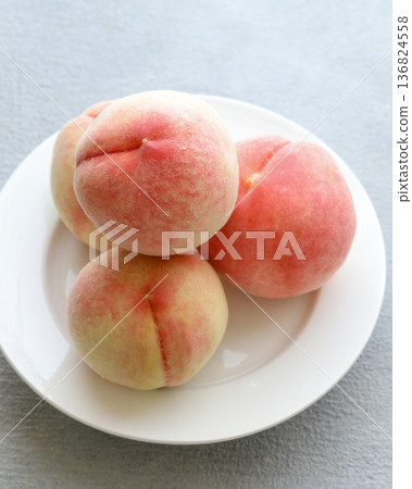 White peaches on a plate 136824558