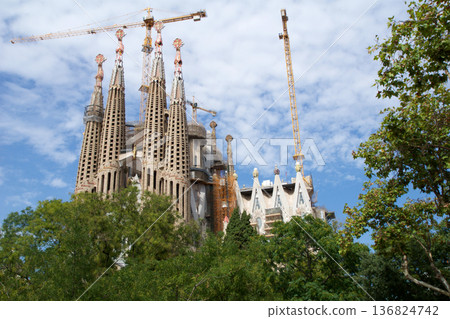 Barcelona, Spain, August 30, 2017: Sagrada Familia under construction with crane Barcelona, Spain, August 30, 2017: Sagrada Familia under construction with crane 136824742