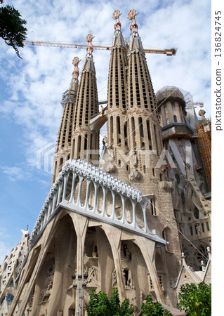 Barcelona, Spain, August 30, 2017: Sagrada Familia under construction with crane Barcelona, Spain, August 30, 2017: Sagrada Familia under construction with crane 136824745