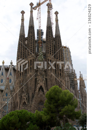 Barcelona, Spain, August 30, 2017: Sagrada Familia under construction with crane Barcelona, Spain, August 30, 2017: Sagrada Familia under construction with crane 136824829