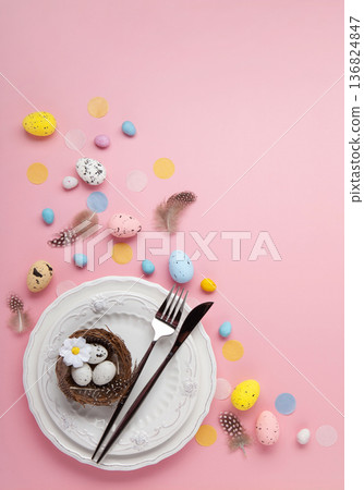 Easter spring holiday card. Playful bunny, painted eggs, spring flowers, decorative elements on light pink background Easter spring holiday card. Playful bunny, painted eggs, spring flowers, decorative elements on light pink background 136824847