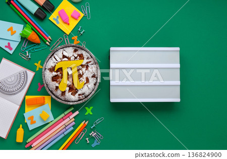 World Pi day. Baked apple pie with Pi Symbol and stationery, green background. March 14th (3/14). Mathematical constant. World Pi day. Baked apple pie with Pi Symbol and stationery, green background. March 14th (3/14). Mathematical constant. 136824900