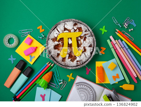 World Pi day. Baked apple pie with Pi Symbol and stationery, green background. March 14th (3/14). Mathematical constant. World Pi day. Baked apple pie with Pi Symbol and stationery, green background. March 14th (3/14). Mathematical constant. 136824902