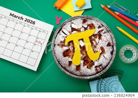 World Pi day. Baked apple pie with Pi Symbol and stationery, green background. March 14th (3/14). Mathematical constant. World Pi day. Baked apple pie with Pi Symbol and stationery, green background. March 14th (3/14). Mathematical constant. 136824904
