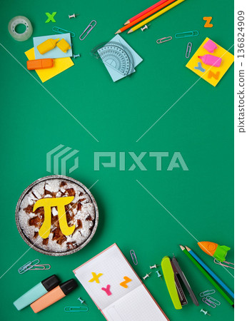 World Pi day. Baked apple pie with Pi Symbol and stationery, green background.   March 14th (3/14). Mathematical constant. 136824909