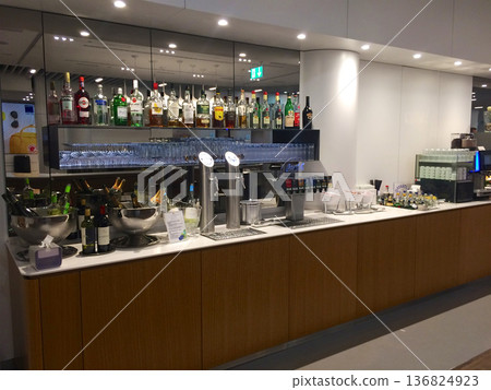 Frankfurt, Germany, 02 September 2017: Self service drinks area with spirits beer tap and soft drinks in a frequent flyer lounge 136824923