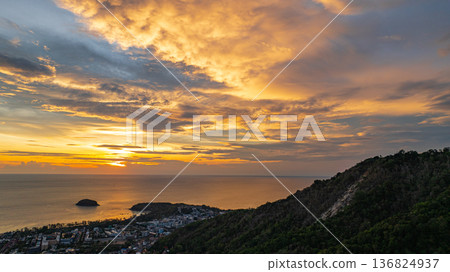 Vibrant Sunset Over Coastal Town and Hills Vibrant Sunset Over Coastal Town and Hills 136824937