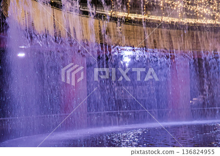 The lit-up fountain plaza at Fugan Canal Kansui Park in Toyama City is even more beautiful with the falling snow. 136824955
