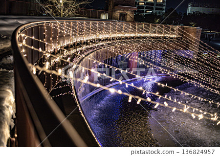 The lit-up fountain plaza at Fugan Canal Kansui Park in Toyama City is even more beautiful with the falling snow. The lit-up fountain plaza at Fugan Canal Kansui Park in Toyama City is even more beautiful with the falling snow. 136824957
