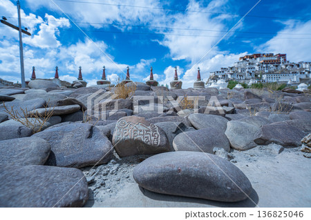Prayers inscribed on a stone in front of Thiksey Monastery 136825046