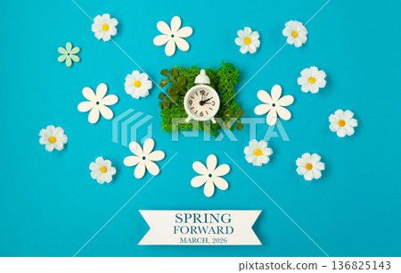 Daylight saving Time, Spring forward, Summer back concept. White Alarm Clock and Spring Daisy Flowers on Blue Background 136825143