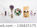 Chakra Crystal Healing Ritual With Lavender Palo Santo White Sage Essential Oils And Candles On White Marble Background 136825175