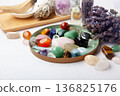 Chakra Crystal Healing Ritual With Lavender Palo Santo White Sage Essential Oils And Candles On White Marble Background 136825176