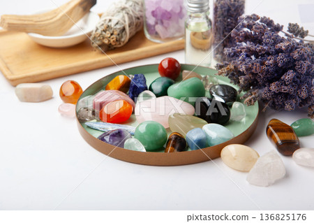 Chakra Crystal Healing Ritual With Lavender Palo Santo White Sage Essential Oils And Candles On White Marble Background 136825176