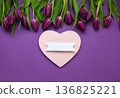 Mother's Day, Woman's day holiday card with purple tulips flowers  on purple background. Top view, copy space 136825221